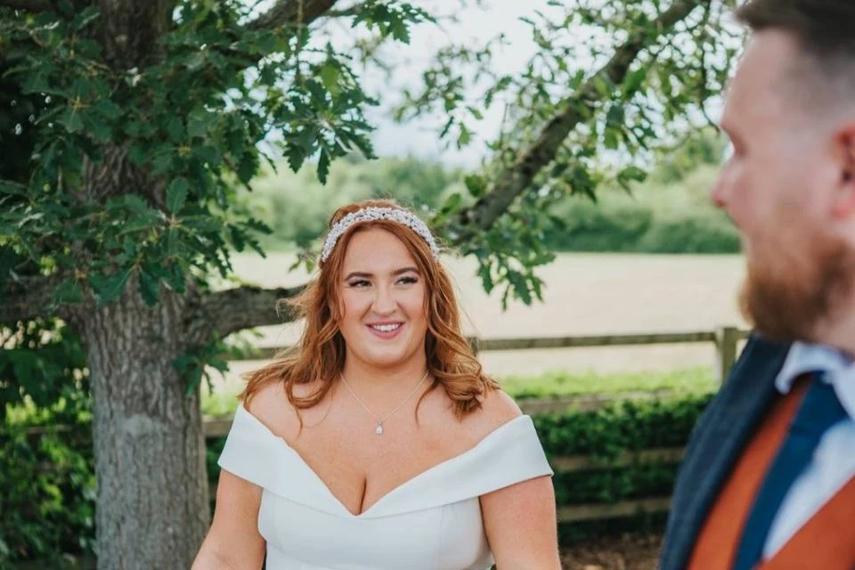 Bride with radiant soft-glam makeup outdoors