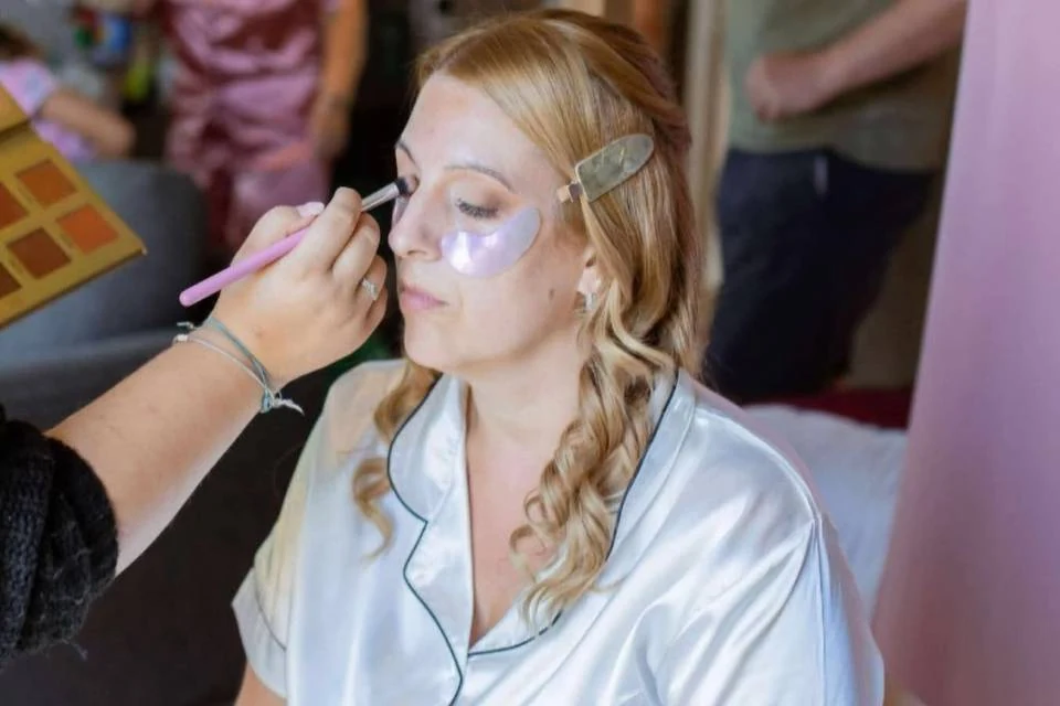 Professional makeup being applied to a bride
